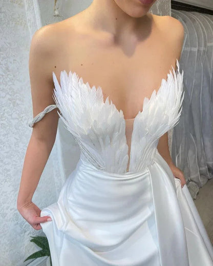 A Dress With Feathers Sweeping The Floor - Gizmo Galaxy